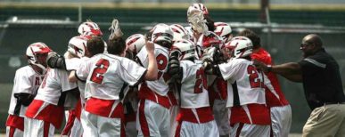 Lacrosse_Victory.jpg A high school boys' lacrosse team celebrates a victory.